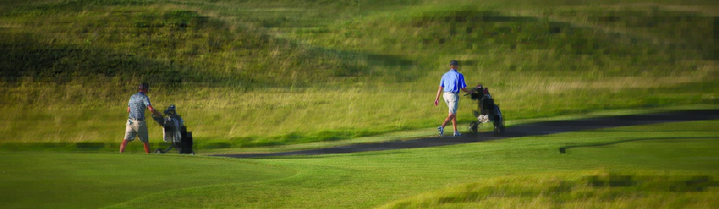 Golfers walking the fairway at King's Walk Golf Course